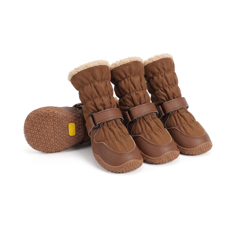 Snow proof outdoor dog boots in mocha brown featuring a soft fleece interior lining and textured high grip bases.