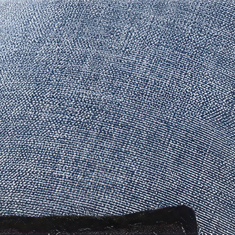 Close-up of denim blue three-layer softshell nano-waterproof fabric canopy on sock-style dog boots.