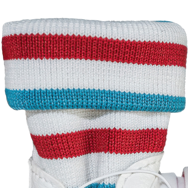 Macro view of the high elastic ribbed knit sock-top dog shoes collar with red and blue stripes.