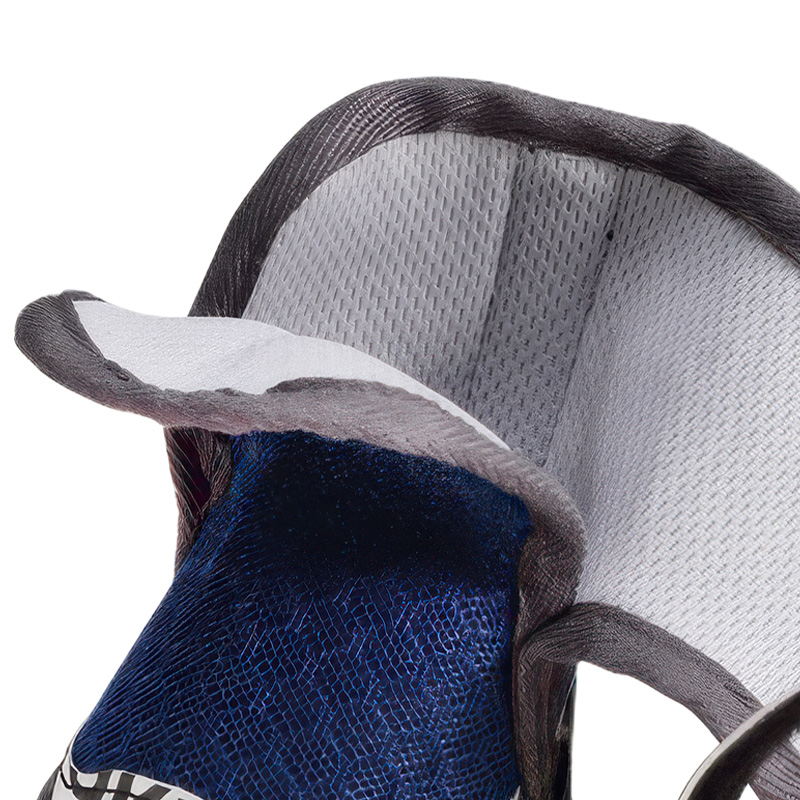 Internal profile of soft-sole dog shoes for cushioning displaying the porous light grey rub free inner lining grid.
