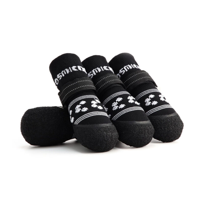 Stealth black soft-sole dog socks with white pattern detailing and reflective secure-fit velcro straps.