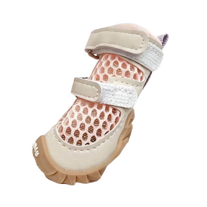 Ergonomic Soft-Sole Construction Close Up Profile View Side profile of soft-sole summer dog shoes in blush pink showing the deep tread grip pattern and wide entry throat.