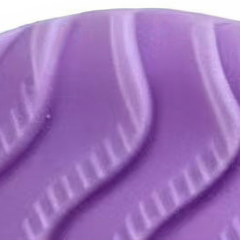 Underneath macro profile of soft-sole summer dog shoes showcasing the deeply grooved traction wave pattern.