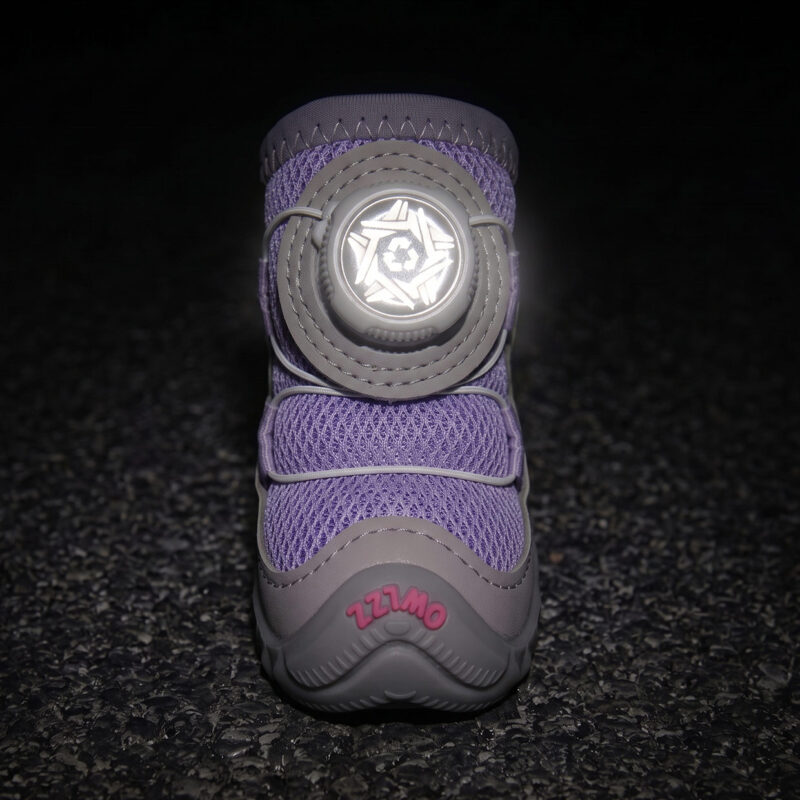 High Visibility Night Safety Reflective Dial Glow Front view of a purple sparkly mesh dog shoe with its white central wire dial glowing brightly under low-light flash parameters.