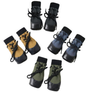 Circular flat lay arrangement of stay-on socks for active dogs showcasing the robust wrap-around lacing configuration.