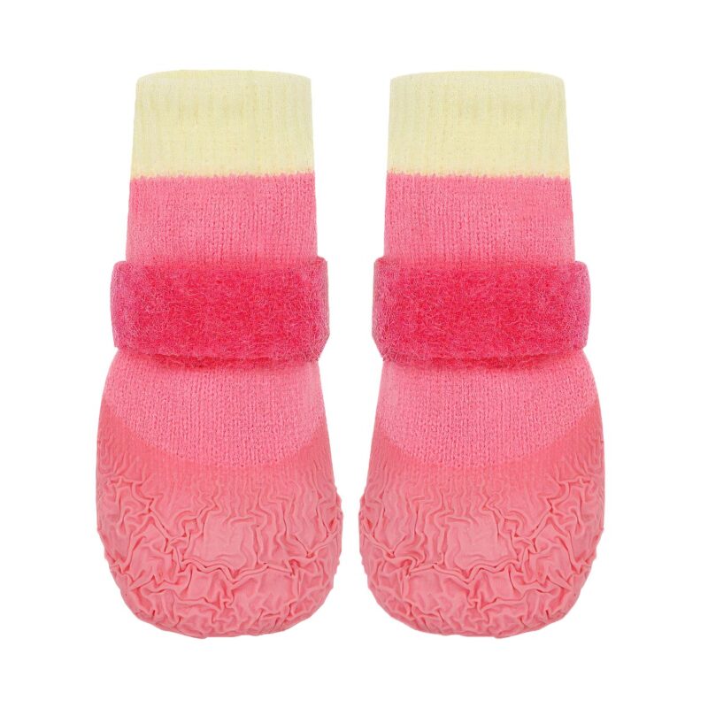A pair of pink stay-on socks with velcro straps showing the wide adjustable fastening system and rib-knit sleeve.