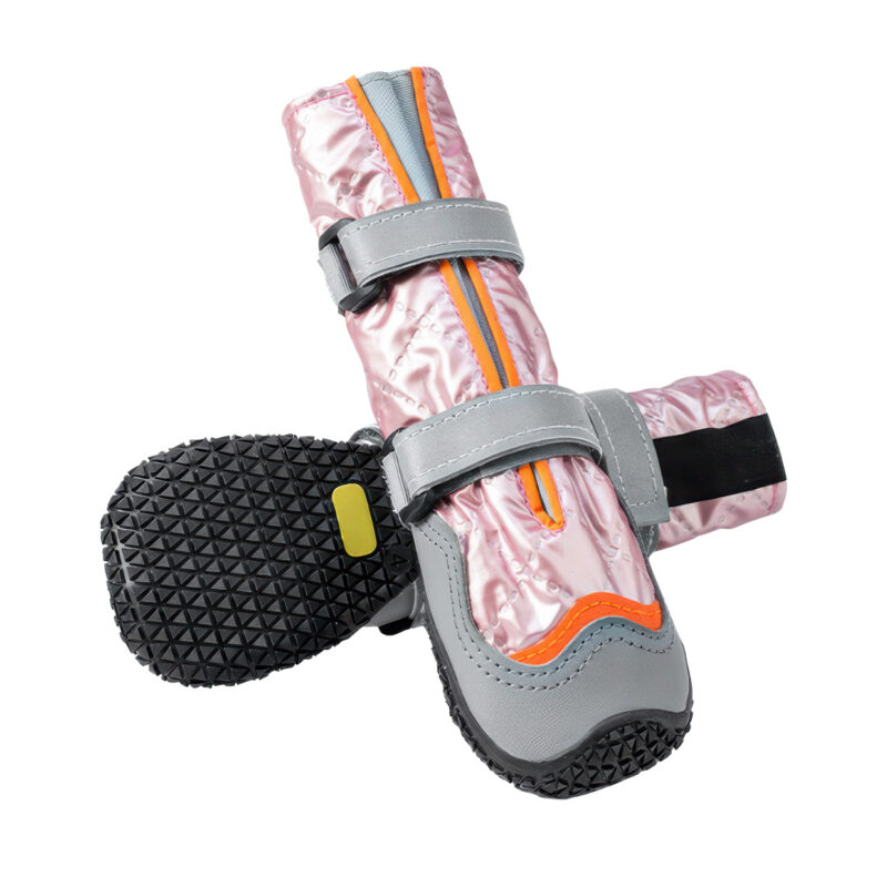 Stay-On Winter Boots Non-Slip Base Details Stay-on winter boots in coral pink showcasing the deep geometric triangular traction tread grid on the black base.