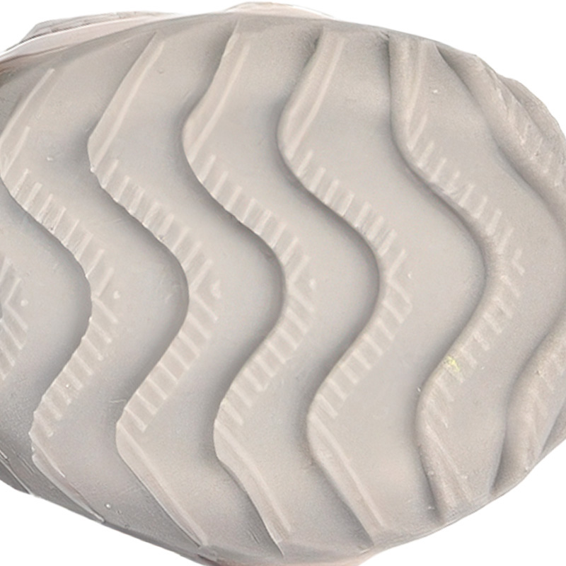 Underneath view of summer dog shoes for hot pavement showing the deeply grooved anti slip rubber wave traction patterns.