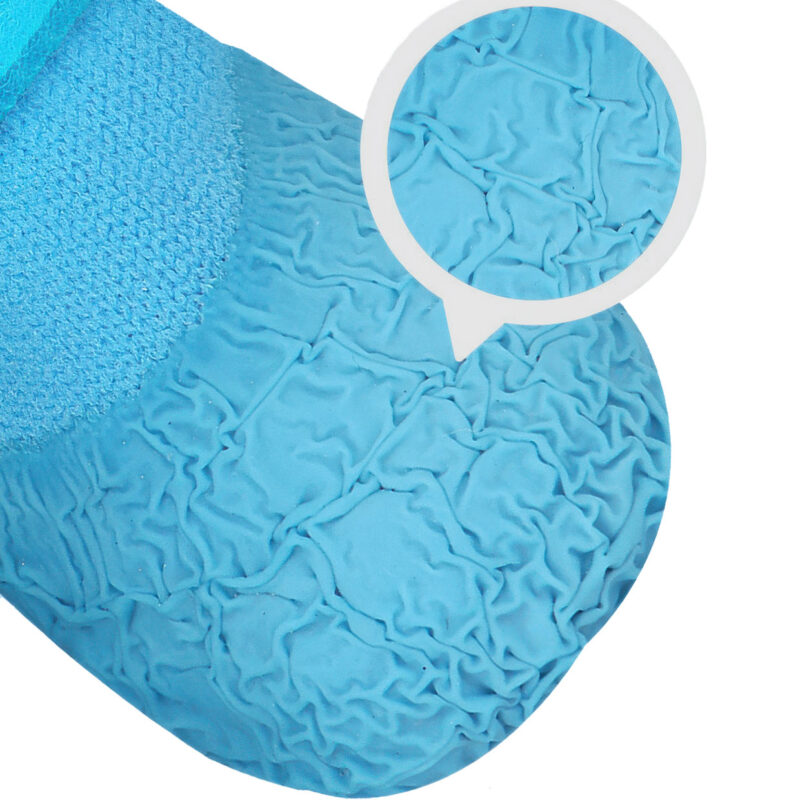 Extreme macro shot showcasing the wrinkle textured process on the rubber bottom of textured sole dog booties.