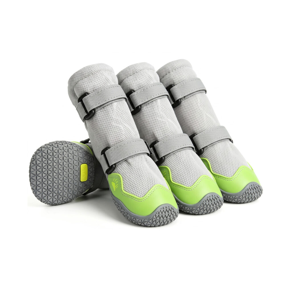 Thick mesh dog boots in neon lime showing four structured tall-shaft booties with gray anti-slip rubber outsoles.