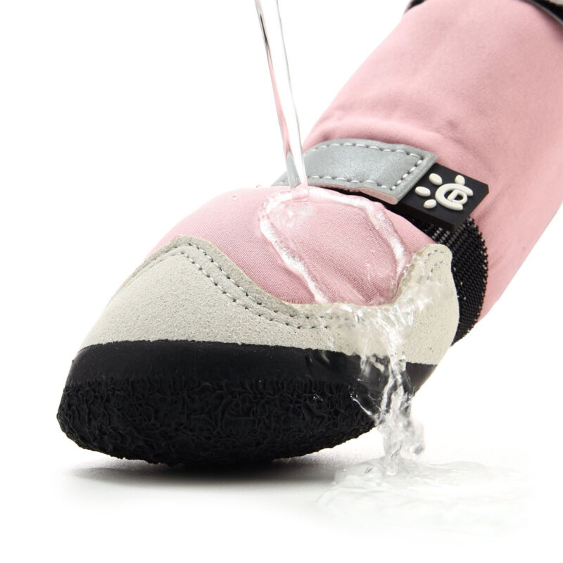 Water-Resistant Dog Boots Hydrophobic Coating Test Hydrophobic test on water-resistant dog boots showing clear water stream repelling off the pink fabric canopy.