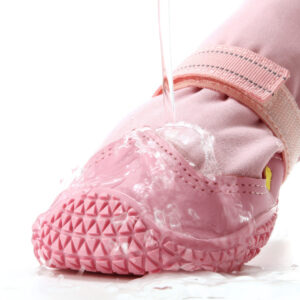 Water-Resistant Large Dog Boots Splash Proof Test Hydrophobic test on water-resistant large dog boots with a water stream beads splashing off the pink elastic fabric.