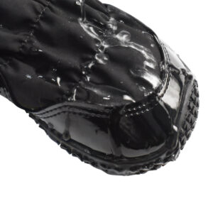 Hydrophobic test on water-resistant winter dog boots displaying water stream beads running off the microfiber toe cap.