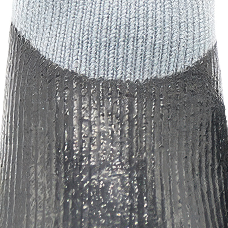 Close-up detailing the seamless transition from knit fabric to waterproof dipped dog booties rubber coating.