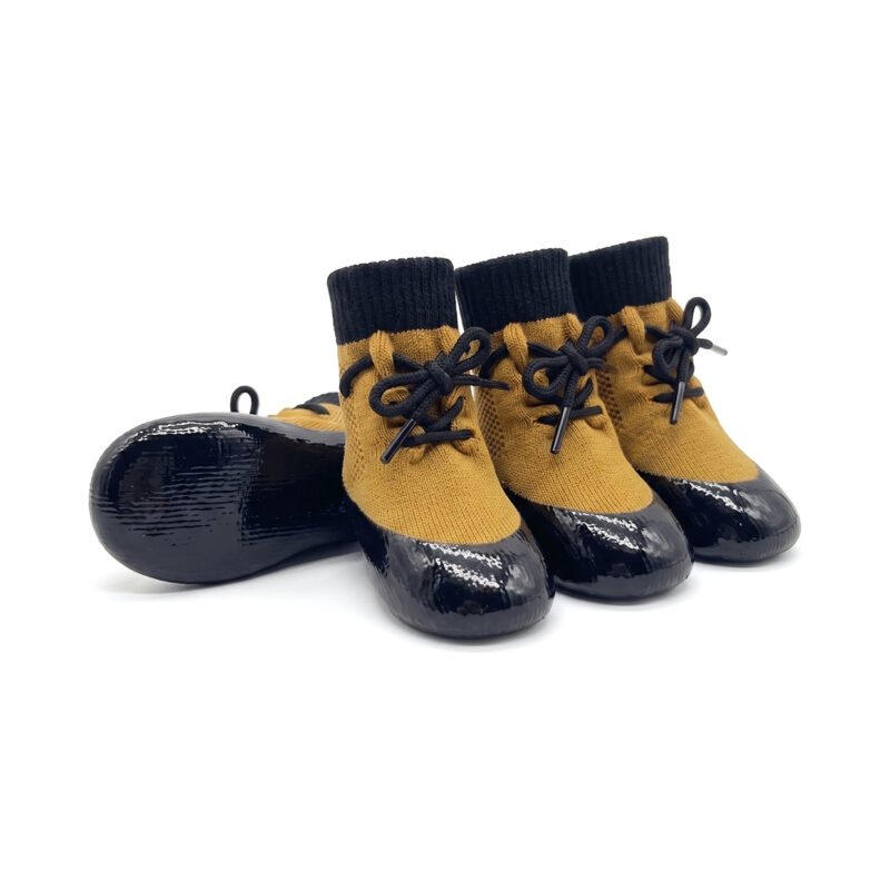 Camel tan waterproof lace-up dog socks featuring a secure black lacing cord and shiny black rubber bases.