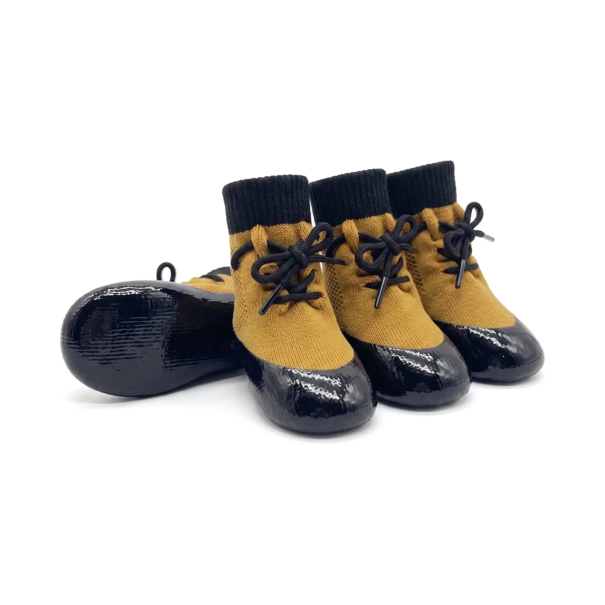 Camel tan waterproof lace-up dog socks featuring a secure black lacing cord and shiny black rubber bases.