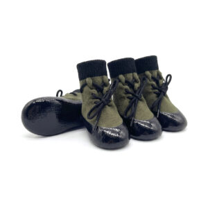 Sage green drawstring knit dog booties with flexible black protective rubber soles for active dogs.