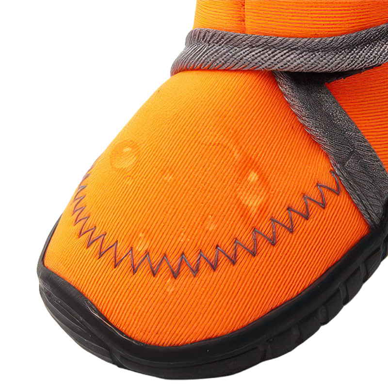 Close-up of tangerine orange waterproof neoprene dog boots fabric canopy displaying advanced micro-elastic textures.